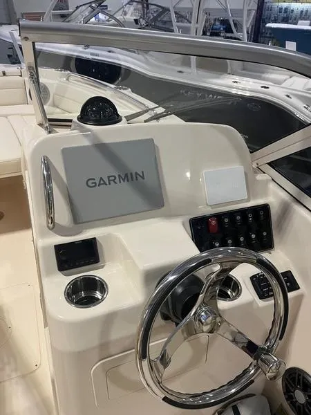 Slide: The Image of 2024 Grady-White Freedom 215 boat dashboard with Garmin navigation system. - 7