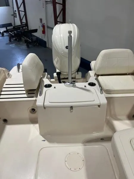 Slide: The Image of 2024 Grady-White Freedom 215 boat interior with seating and motor. - 8