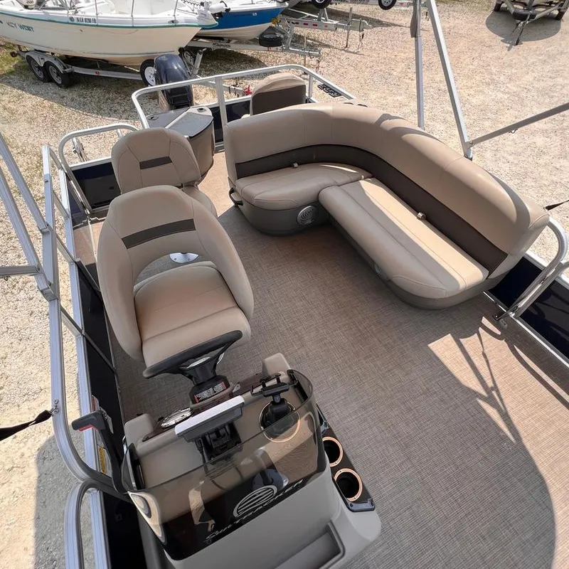 Slide: The Image of 2023 Sun Tracker Party Barge 18 DLX interior with seating and helm station. - 13