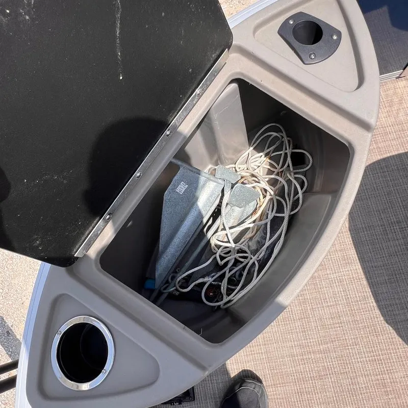 Slide: The Image of Storage compartment with anchor and rope on 2023 Sun Tracker Party Barge 18 DLX. - 18