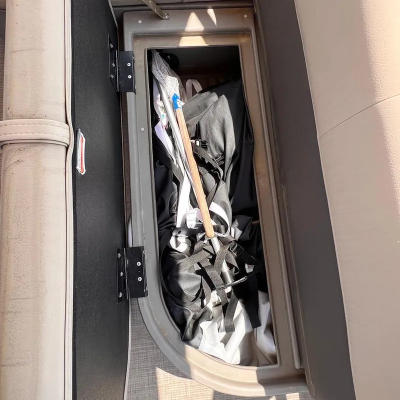 Slide: The Image of Storage compartment in 2023 Sun Tracker Party Barge 18 DLX pontoon boat. - 21