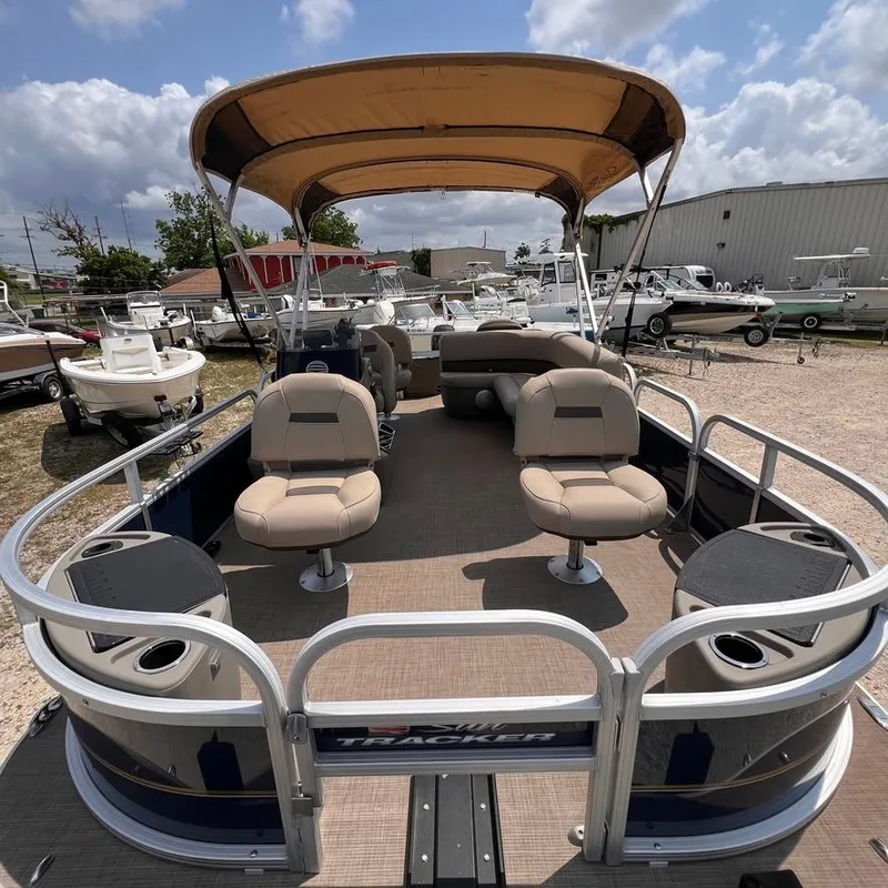 Slide: The Image of 2023 Sun Tracker Party Barge 18 DLX pontoon boat with canopy and seating. - 9