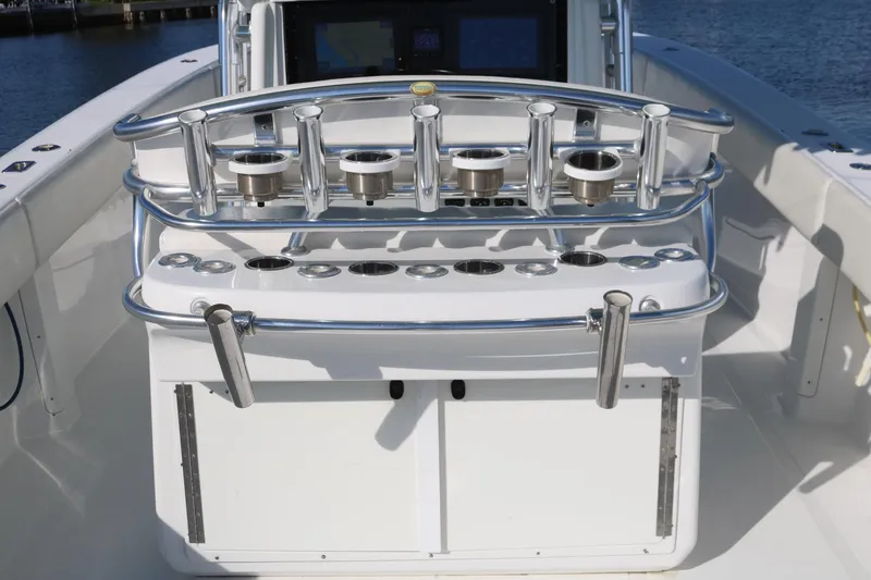 Slide: The Image of 2008 Venture 39 Center Console boat with rod holders and storage compartments. - 10