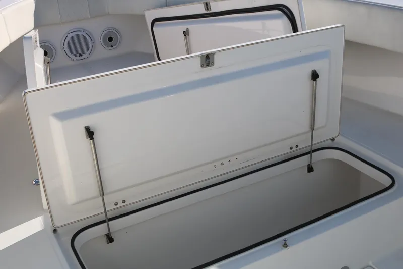 Slide: The Image of 2008 Venture 39 Center Console boat storage compartments and speakers. - 13