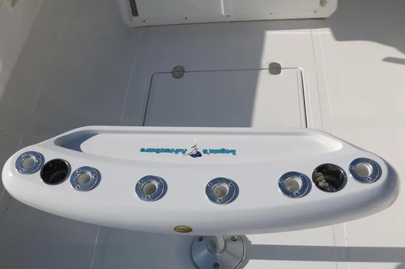 Slide: The Image of 2008 Venture 39 Center Console fishing rod holders on deck. - 16