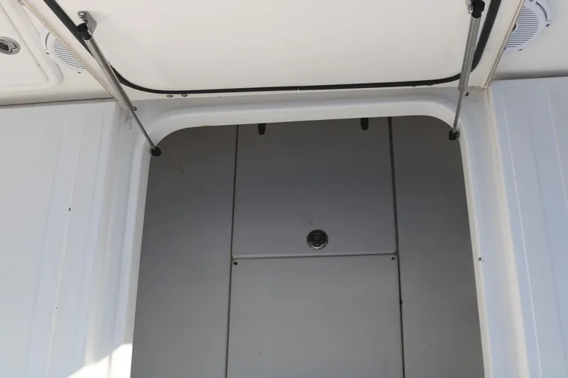 Slide: The Image of 2008 Venture 39 Center Console storage compartment. - 19