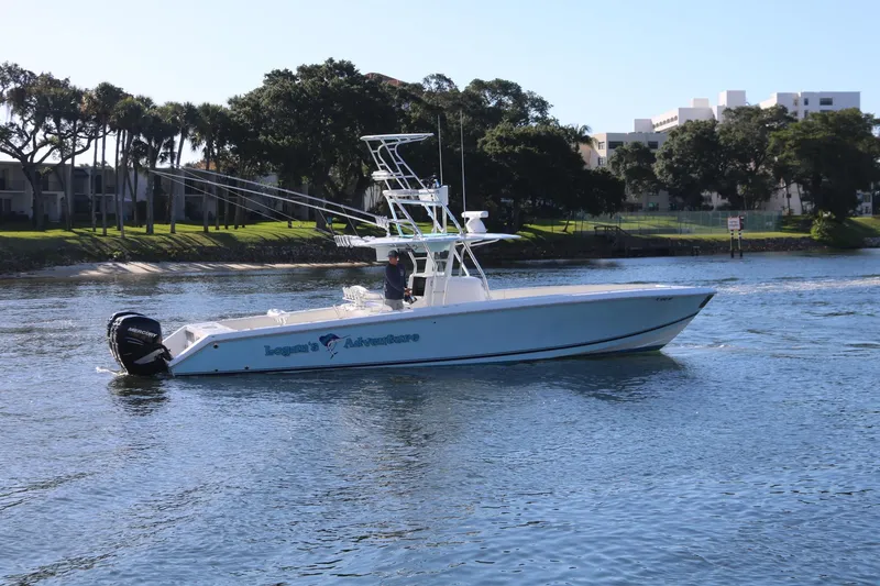 Slide: The Image of 2008 Venture 39 Center Console boat cruising on a calm river. - 28