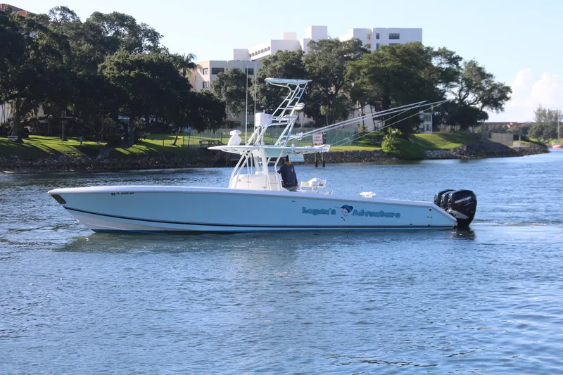Slide: The Image of 2008 Venture 39 Center Console boat cruising on a calm river. - 33