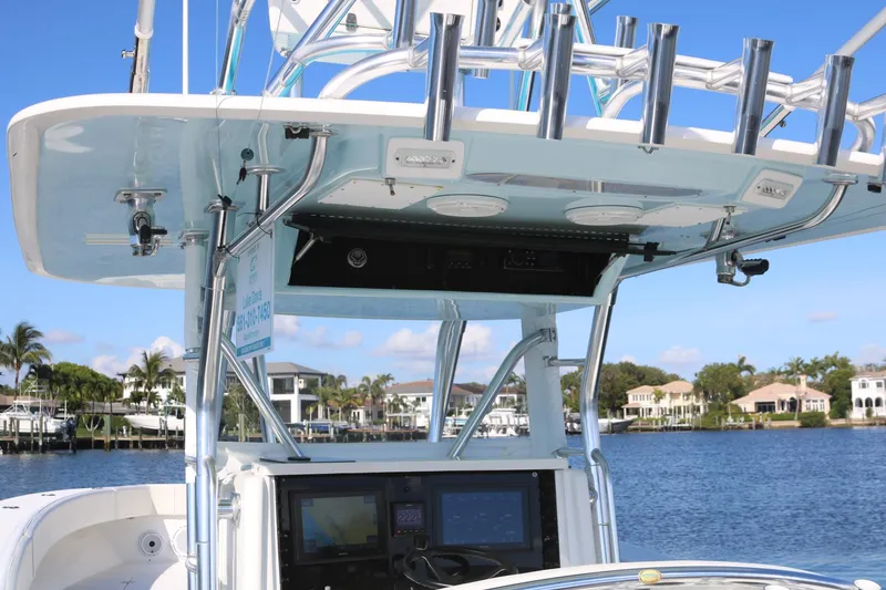 Slide: The Image of 2008 Venture 39 Center Console boat with advanced navigation system on a scenic waterfront. - 8