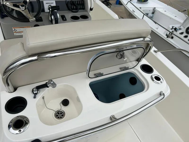 Slide: The Image of 2017 Boston Whaler 270 Dauntless boat interior with sink and storage compartment. - 2