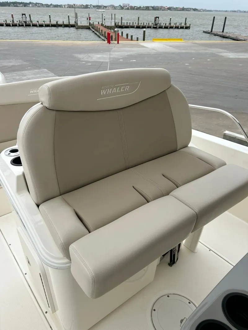 Slide: The Image of 2017 Boston Whaler 270 Dauntless boat seat with waterfront view. - 20