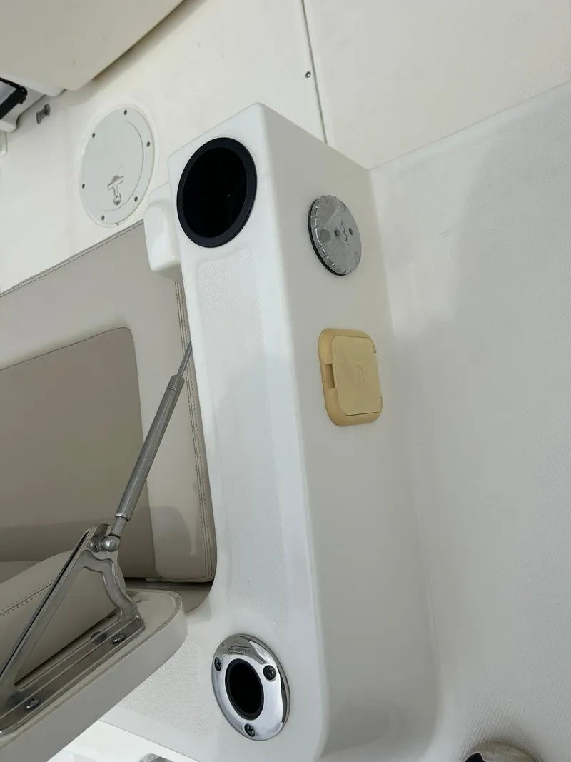 Slide: The Image of 2017 Boston Whaler 270 Dauntless boat interior, featuring cup holders and seating area. - 23