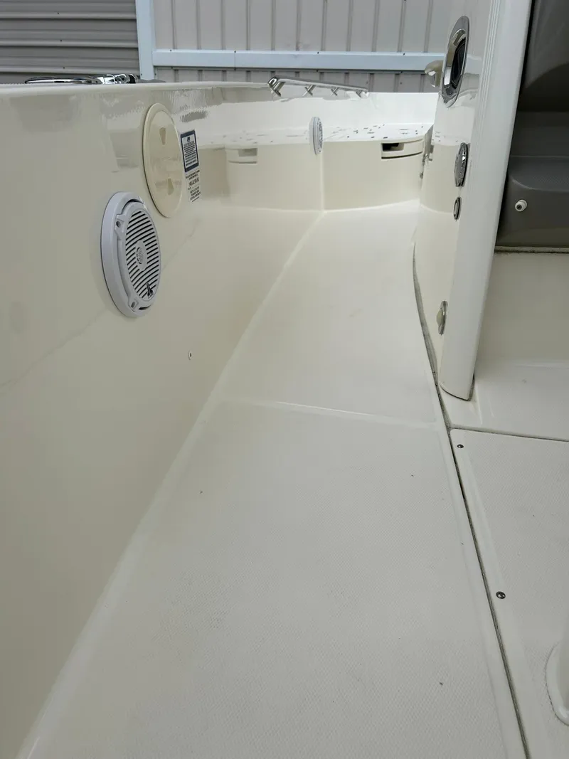 Slide: The Image of 2017 Boston Whaler 270 Dauntless interior view, featuring clean deck and built-in speaker. - 27