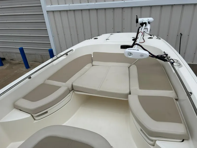 Slide: The Image of 2017 Boston Whaler 270 Dauntless boat with cushioned seating and mounted equipment. - 36