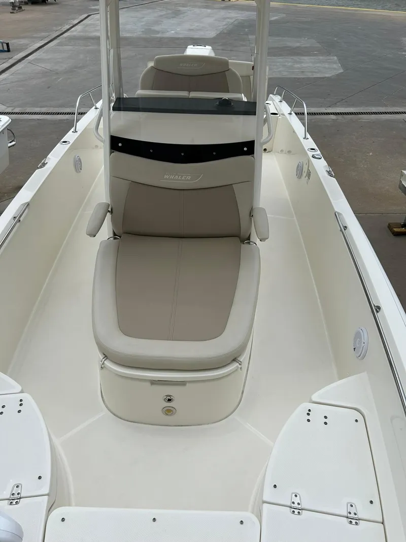 Slide: The Image of 2017 Boston Whaler 270 Dauntless boat with beige seating and sleek design. - 37