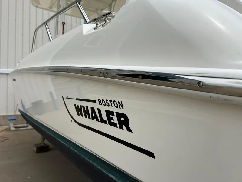 Slide: The Image of 2017 Boston Whaler 270 Dauntless boat side view in a storage facility. - 4