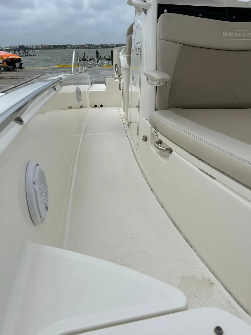Slide: The Image of 2017 Boston Whaler 270 Dauntless boat interior with seating and deck view. - 42