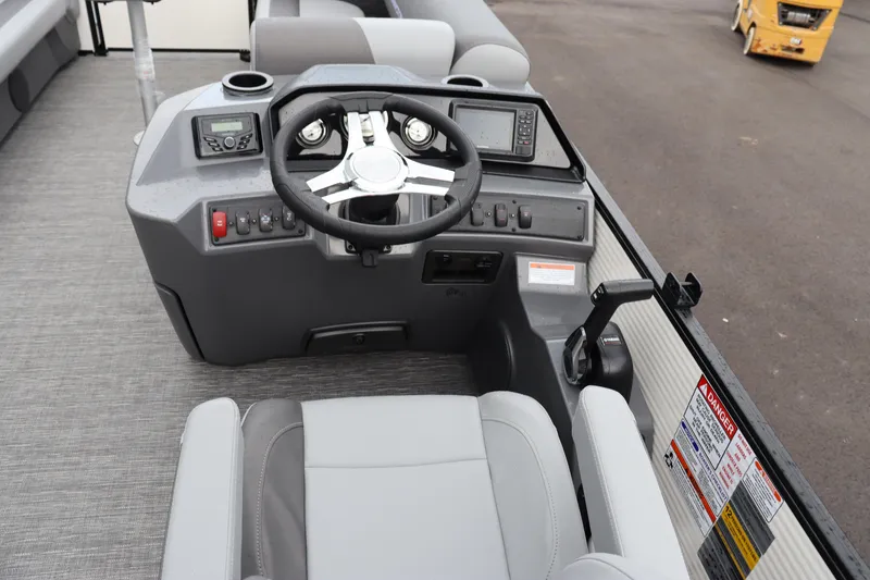 Slide: The Image of 2024 Bennington 22 SSR-SPS boat helm with steering wheel and control panel. - 13