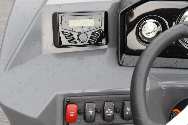 Slide: The Image of Close-up of the 2024 Bennington 22 SSR-SPS boat dashboard with controls and gauges. - 16