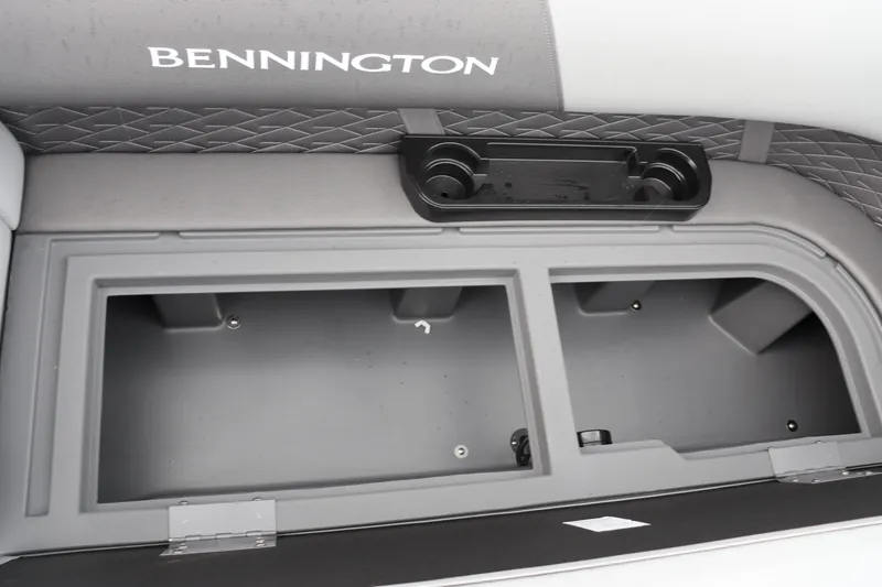Slide: The Image of 2024 Bennington 22 SSR-SPS boat storage compartment with cup holders. - 19