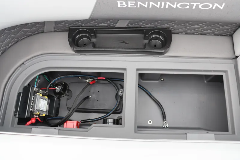 Slide: The Image of 2024 Bennington 22 SSR-SPS boat storage compartment with wiring and cup holders. - 21