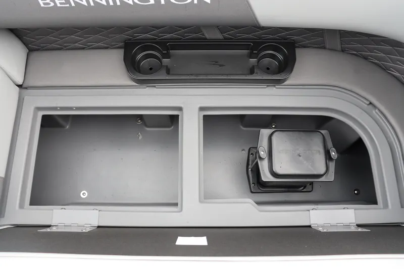 Slide: The Image of 2024 Bennington 22 SSR-SPS boat storage compartments and cup holders. - 23