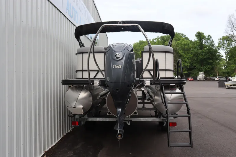 Slide: The Image of 2024 Bennington 22 SSR-SPS pontoon boat with 150 HP engine, rear view. - 4