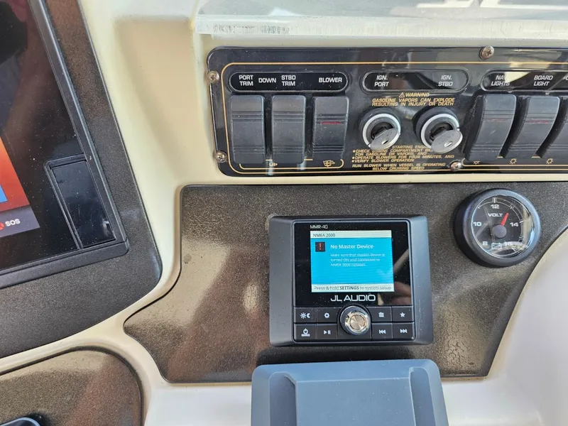Slide: The Image of Control panel of a 2000 Cruisers 3870 Express boat with JL Audio system. - 11