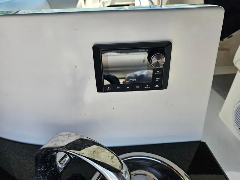 Slide: The Image of Control panel on 2000 Cruisers 3870 Express yacht dashboard. - 15