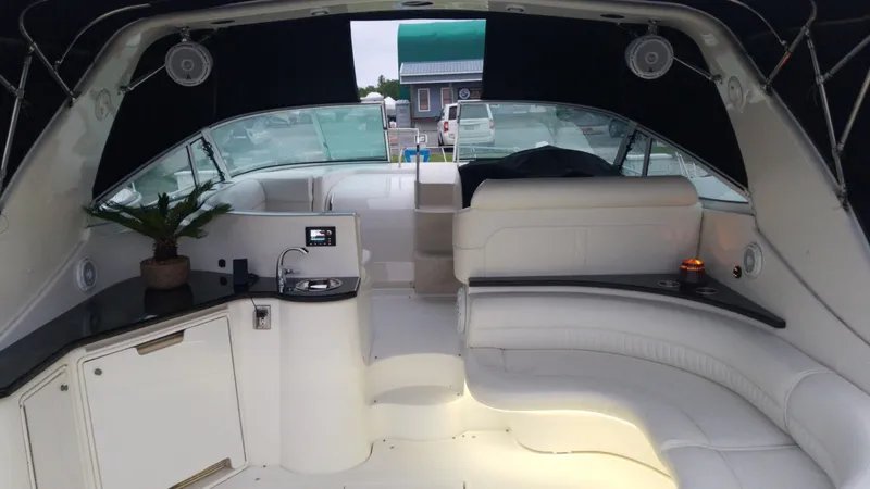 Slide: The Image of Interior of 2000 Cruisers 3870 Express yacht with white seating and modern amenities. - 7