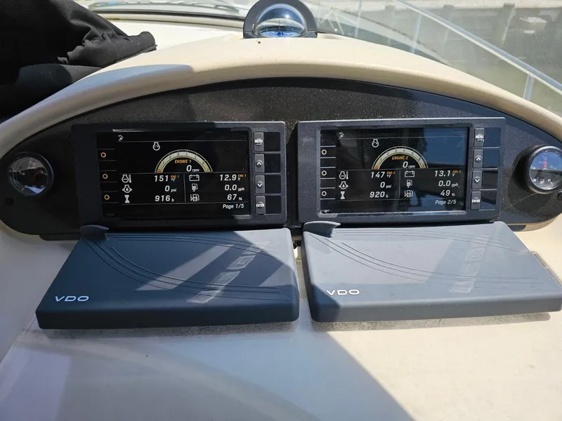 Slide: The Image of Dashboard of a 2000 Cruisers 3870 Express boat with dual VDO displays. - 9
