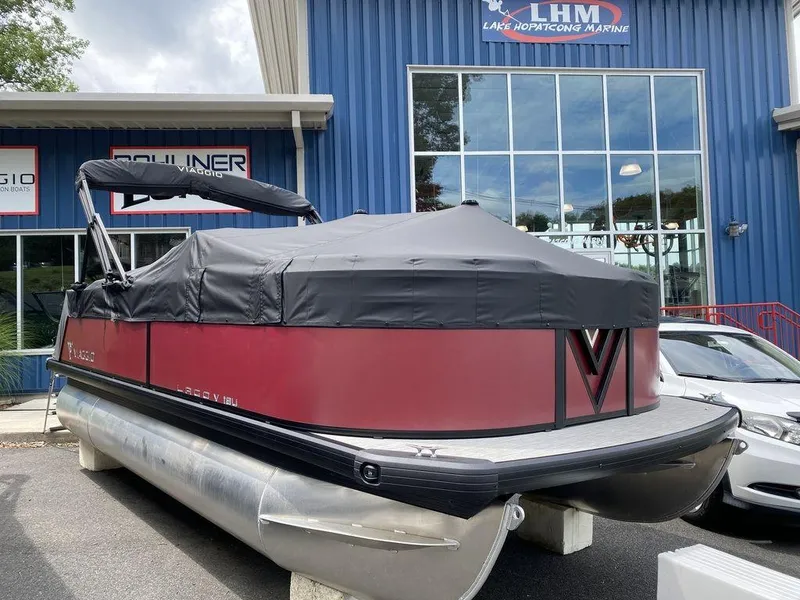 Slide: The Image of 2024 Viaggio Lago V-18U Bi-Toon pontoon boat with cover at dealership. - 11