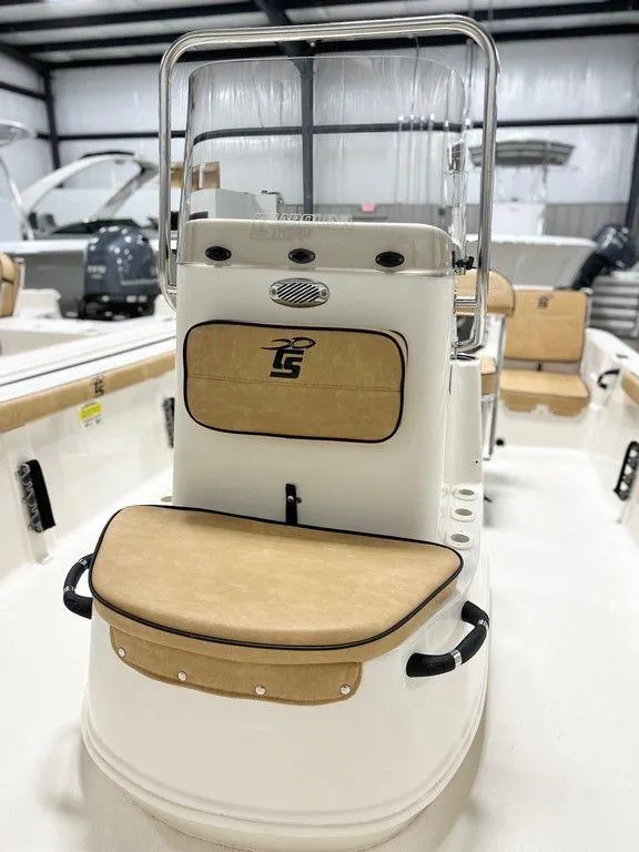 Slide: The Image of 2024 Carolina Skiff 19 LS boat interior with tan seating and console. - 6