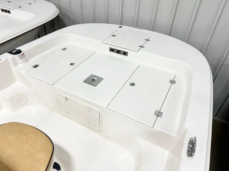 Slide: The Image of 2024 Carolina Skiff 19 LS boat deck with storage compartments and seating. - 8