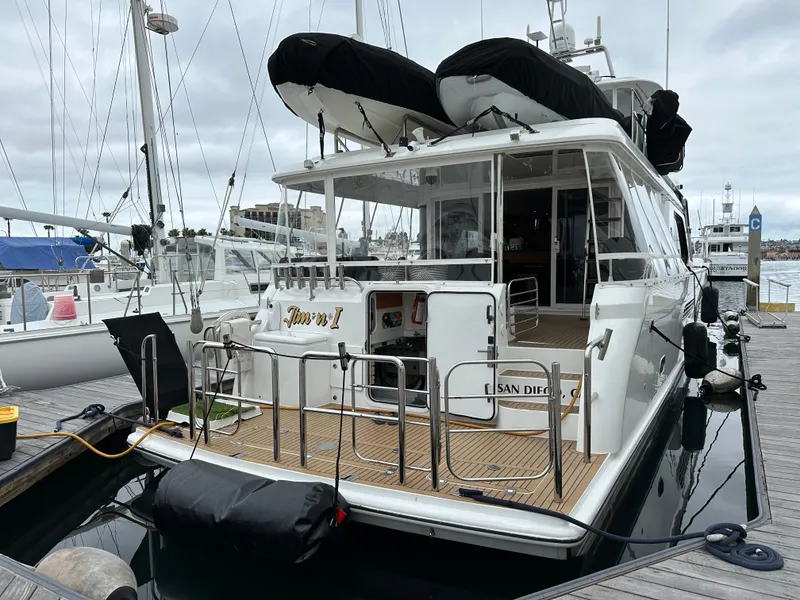 Slide: The Image of 1999 Queenship Cockpit Motoryacht docked at marina, San Diego. - 3