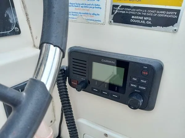 Slide: The Image of Garmin marine radio on 2003 Key Largo 2200 WA boat dashboard. - 11