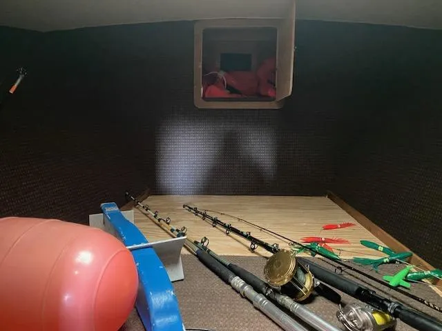 Slide: The Image of Interior of 2022 Custom Carolina Sportfish boat with fishing gear and equipment. - 18