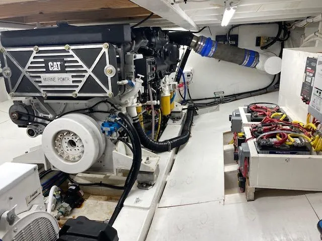 Slide: The Image of Engine room of a 2022 Custom Carolina Sportfish boat with CAT Marine Power engine. - 22