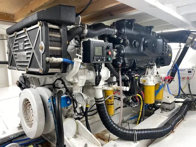 Slide: The Image of 2022 Custom Carolina Sportfish engine room with CAT marine engine. - 23