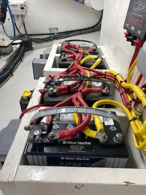 Slide: The Image of Battery compartment of a 2022 Custom Carolina Sportfish boat with West Marine AGM batteries. - 24