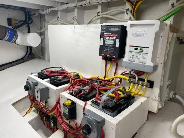 Slide: The Image of Electrical system of a 2022 Custom Carolina Sportfish boat with batteries and wiring. - 25