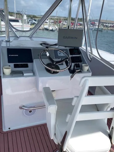 Slide: The Image of 2022 Custom Carolina Sportfish helm with Garmin navigation system. - 31