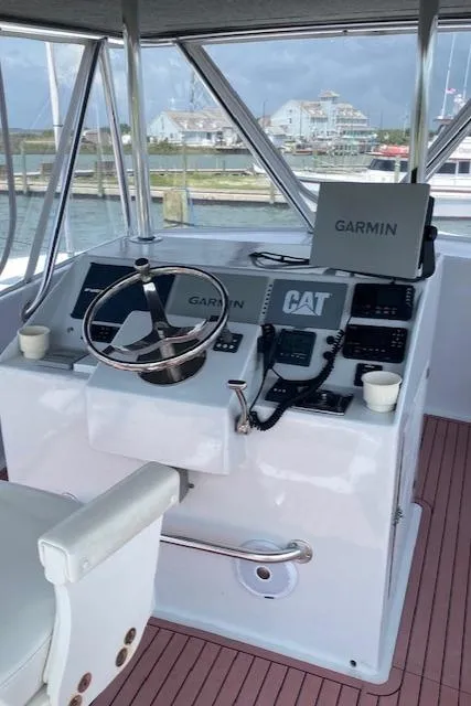 Slide: The Image of 2022 Custom Carolina Sportfish helm with Garmin navigation system. - 32