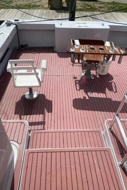 Slide: The Image of 2022 Custom Carolina Sportfish boat deck with seating and fishing station. - 4