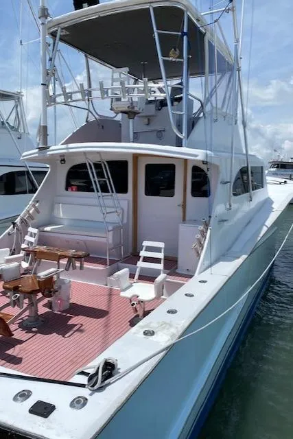 Slide: The Image of 2022 Custom Carolina Sportfish boat docked at marina. - 5