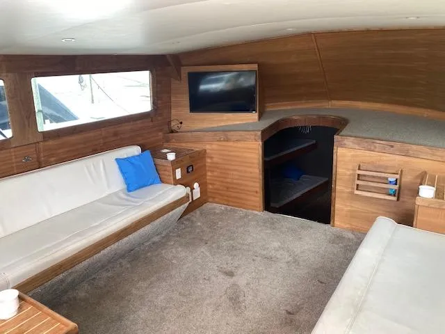 Slide: The Image of Interior of 2022 Custom Carolina Sportfish with modern furnishings and TV. - 7