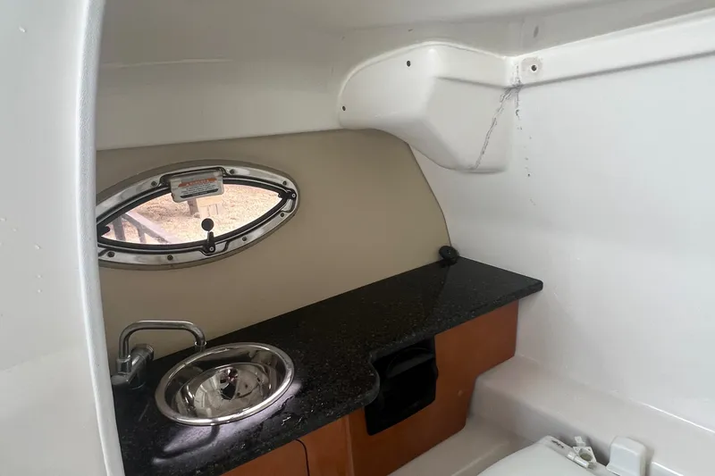 Slide: The Image of 2012 Chaparral 264 Sunesta boat interior with sink and countertop. - 15