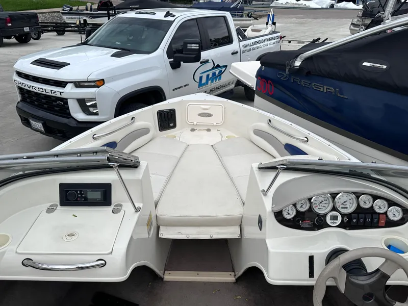 Slide: The Image of 2005 Stingray 195 FX Ski & Fish boat interior with dashboard and seating. - 6