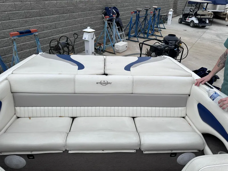 Slide: The Image of 2005 Stingray 195 FX Ski & Fish boat with white and blue seating. - 8