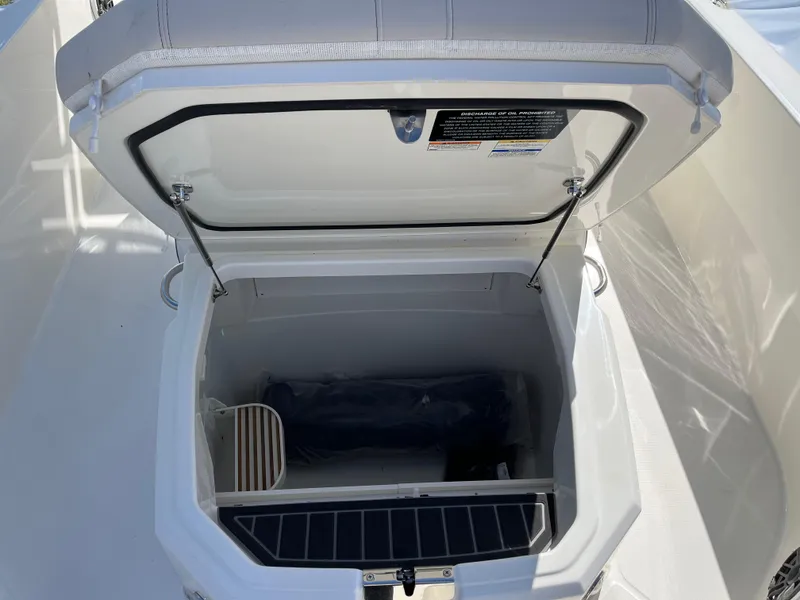 Slide: The Image of Open storage compartment on 2025 Boston Whaler 280 Dauntless boat. - 14